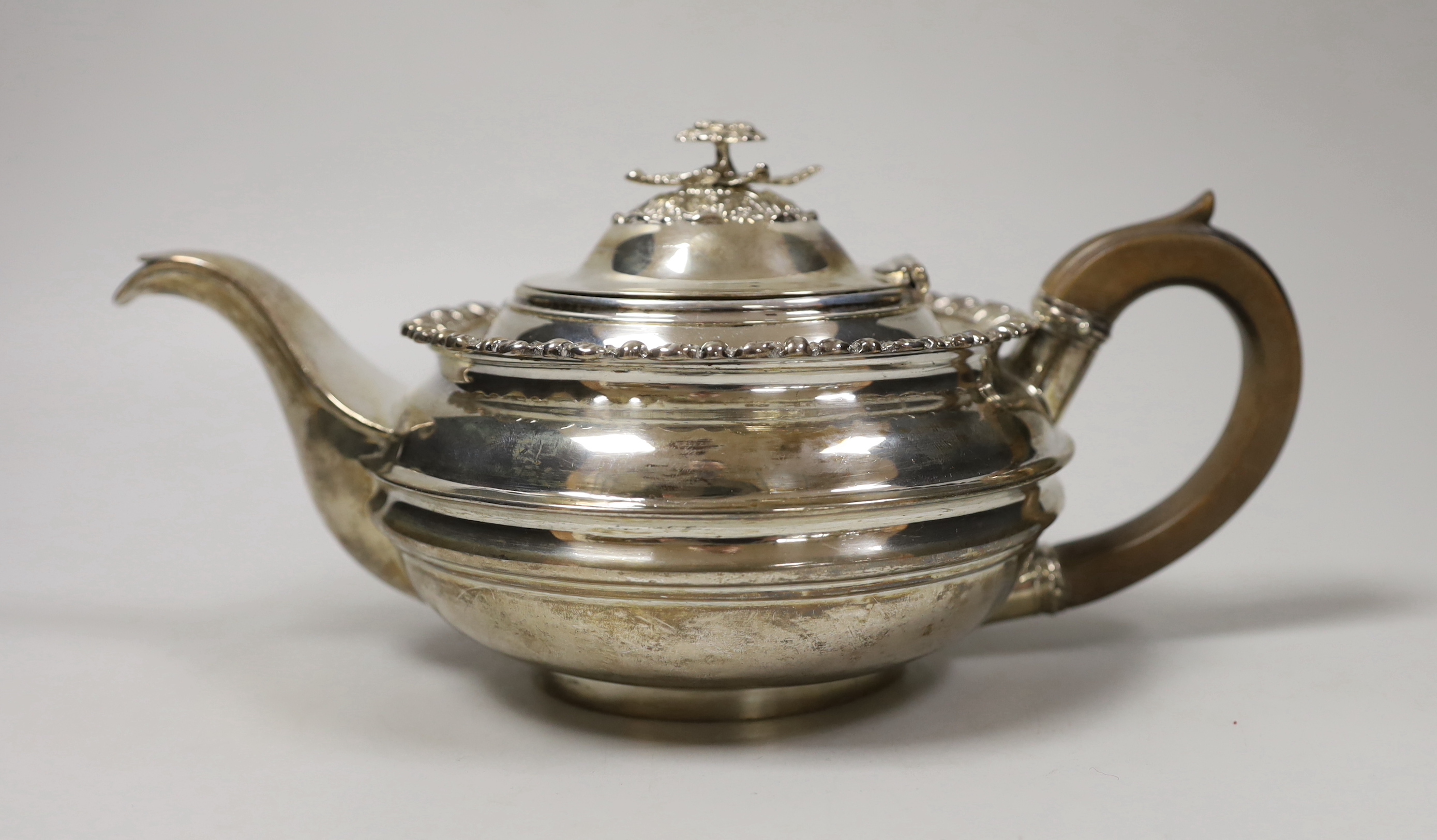 A George III silver squat circular teapot, George Burrows II, London, 1816, gross weight 20.6oz.